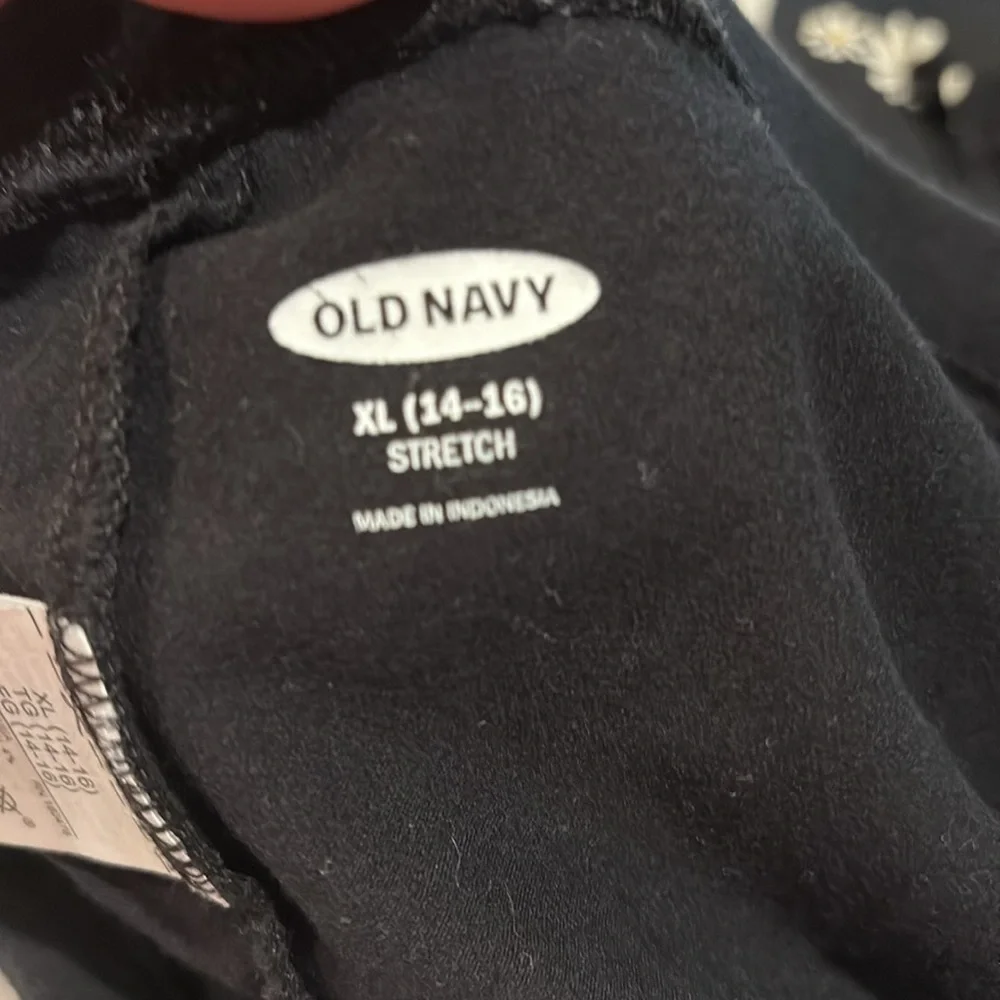 Old navy girls leggings.  size XL (14-16). Black and black with flowers